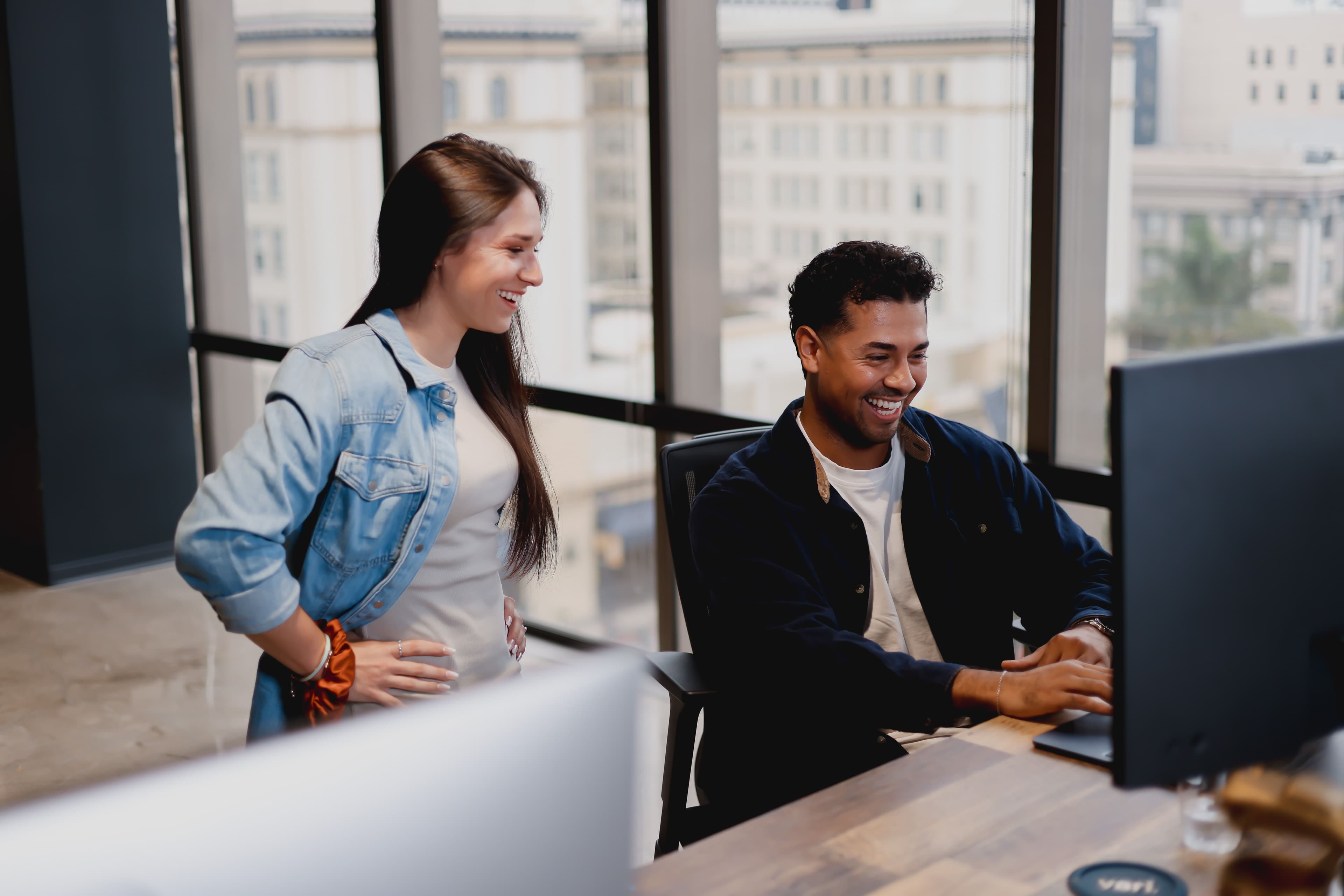 Webstacks employees working at a desktop