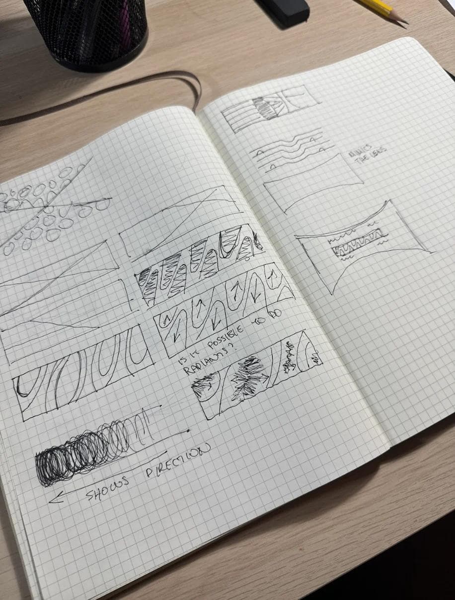 BTB Jordan Layao Image 3 Sketchbook open on a table, showcasing hand-drawn patterns and notes for design ideas.