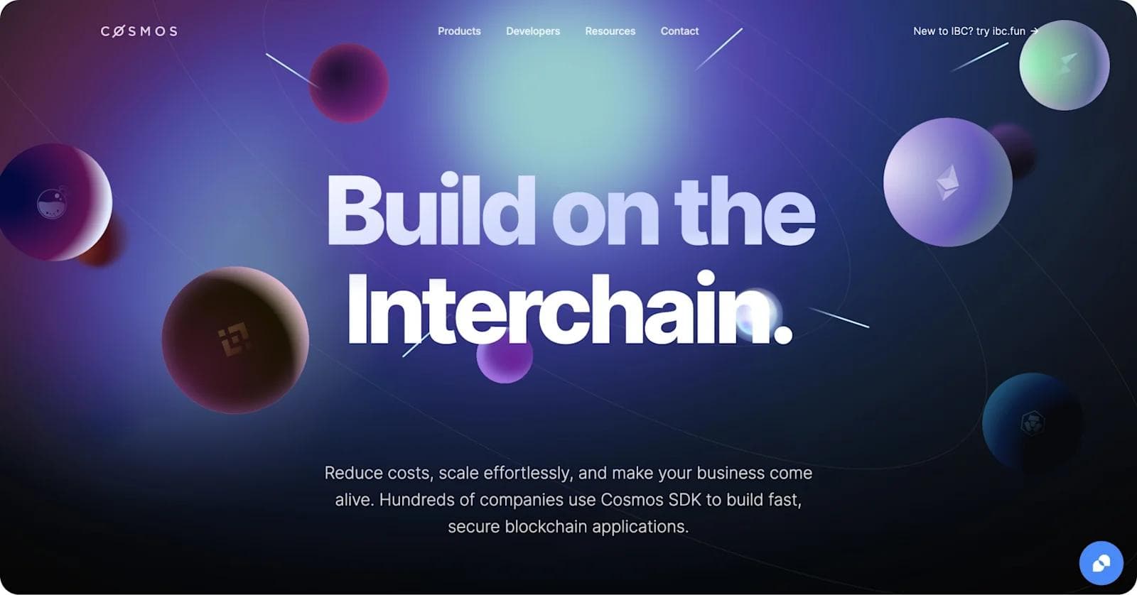cosmos new homepage Background with floating spheres and the text "Build on the Interchain" emphasizing blockchain development and scalability.