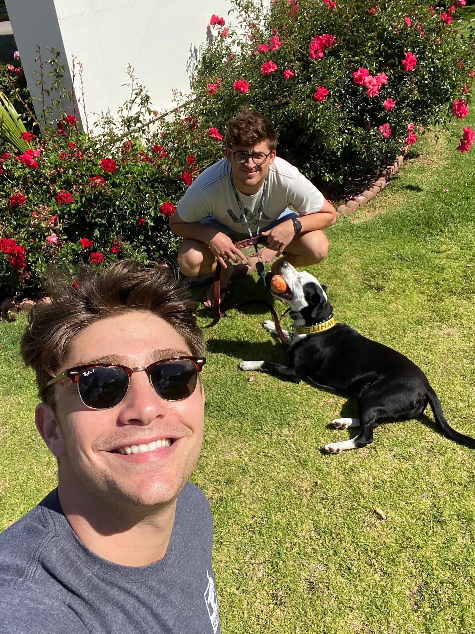 Project Managers Jake Stotter and Sam Ruben hanging out with Hudson.